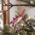 Laser-cut maple wood Sawfish folk art ornament O112 hanging on a fir branch, made in USA