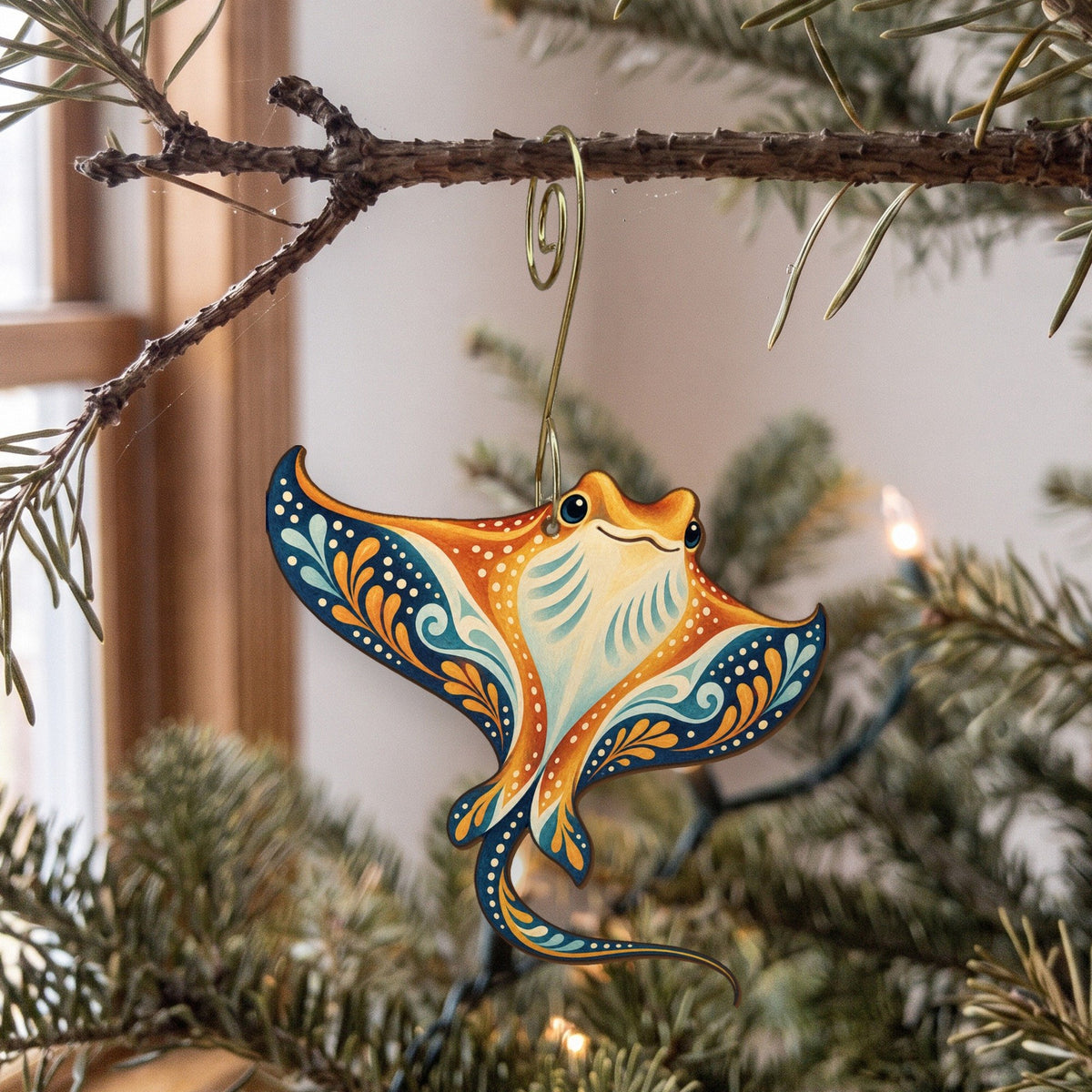 Laser-cut maple wood Cownose Ray folk art ornament O114 hanging on a fir branch, made in USA