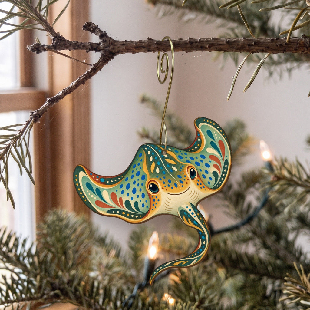 Laser-cut maple wood Blue-Spotted Stingray folk art ornament O115 hanging on a fir branch, made in USA