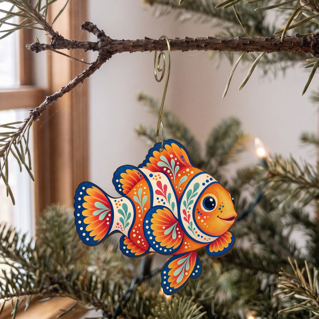 Laser-cut maple wood Clownfish folk art ornament O117 hanging on a fir branch, made in USA