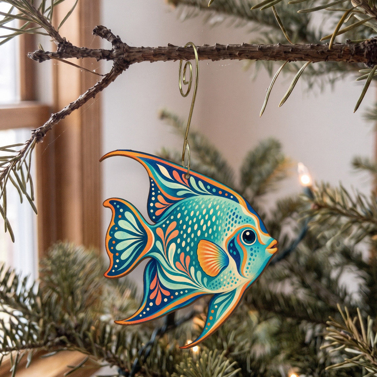 Laser-cut maple wood Queen Angelfish folk art ornament O121 hanging on a fir branch, made in USA