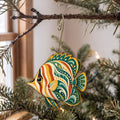 Laser-cut maple wood Butterflyfish folk art ornament O123 hanging on a fir branch, made in USA