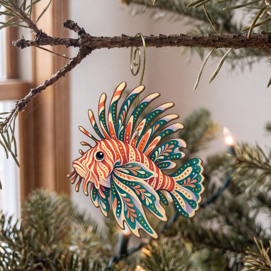 Laser-cut maple wood Lionfish folk art ornament O127 hanging on a fir branch, made in USA