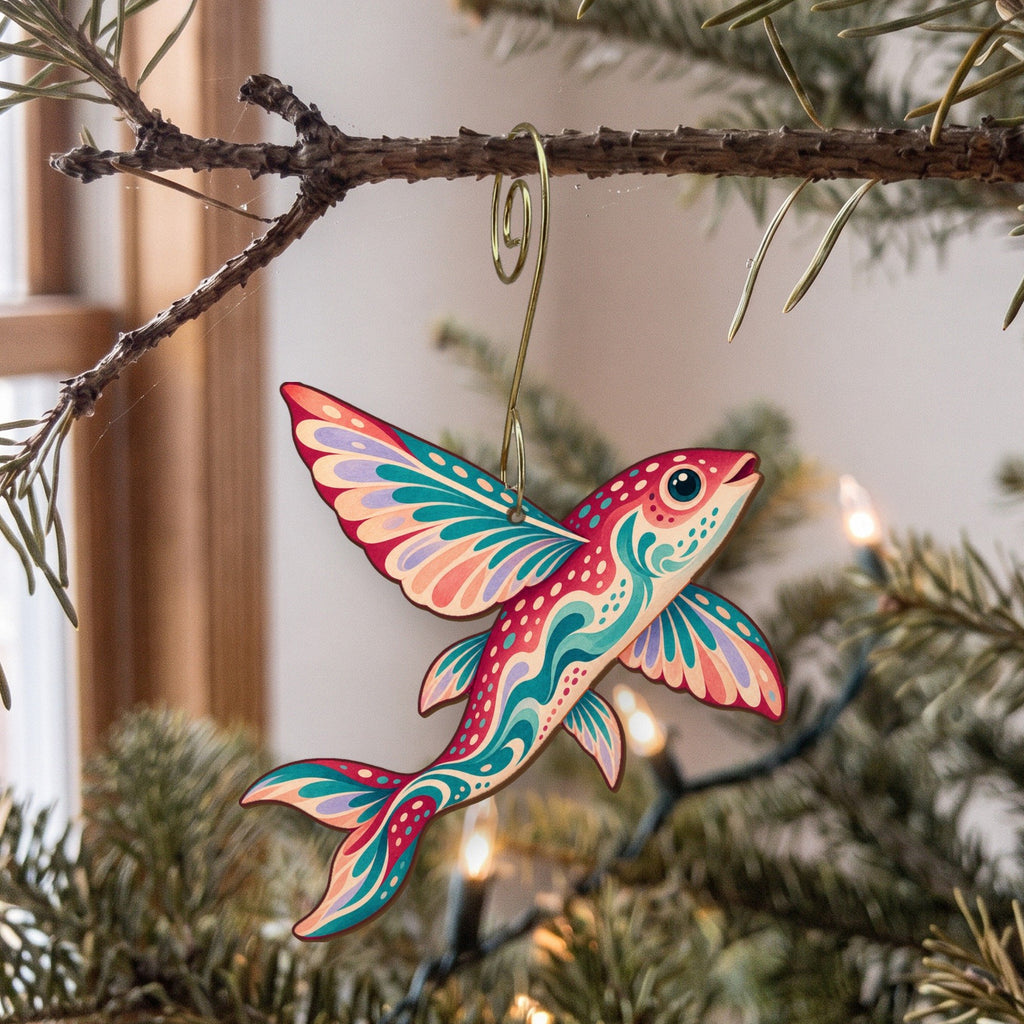 Laser-cut maple wood Flying Fish folk art ornament O128 hanging on a fir branch, made in USA