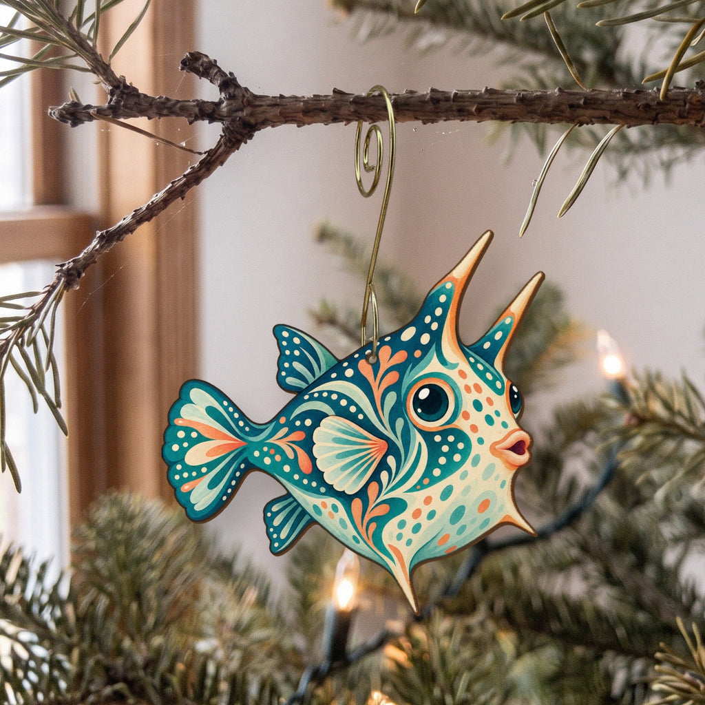 Laser-cut maple wood Longhorn Cowfish folk art ornament O129 hanging on a fir branch, made in USA
