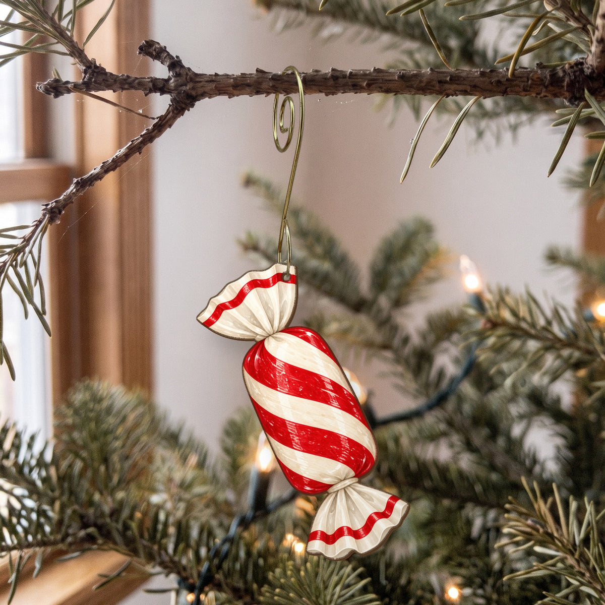 Laser-cut maple wood Christmas ornament O12 hanging on a fir branch, made in USA
