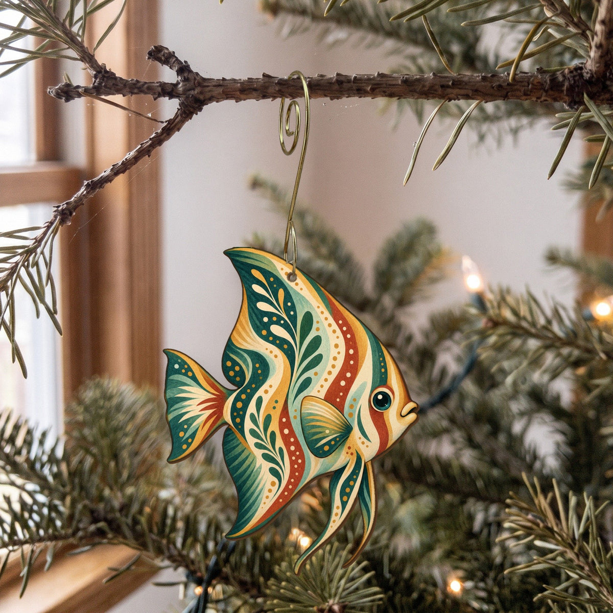 Laser-cut maple wood Batfish folk art ornament O131 hanging on a fir branch, made in USA