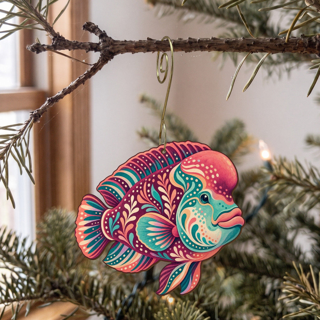 Laser-cut maple wood Napoleon Wrasse folk art ornament O132 hanging on a fir branch, made in USA