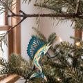 Laser-cut maple wood Sailfish folk art ornament O135 hanging on a fir branch, made in USA