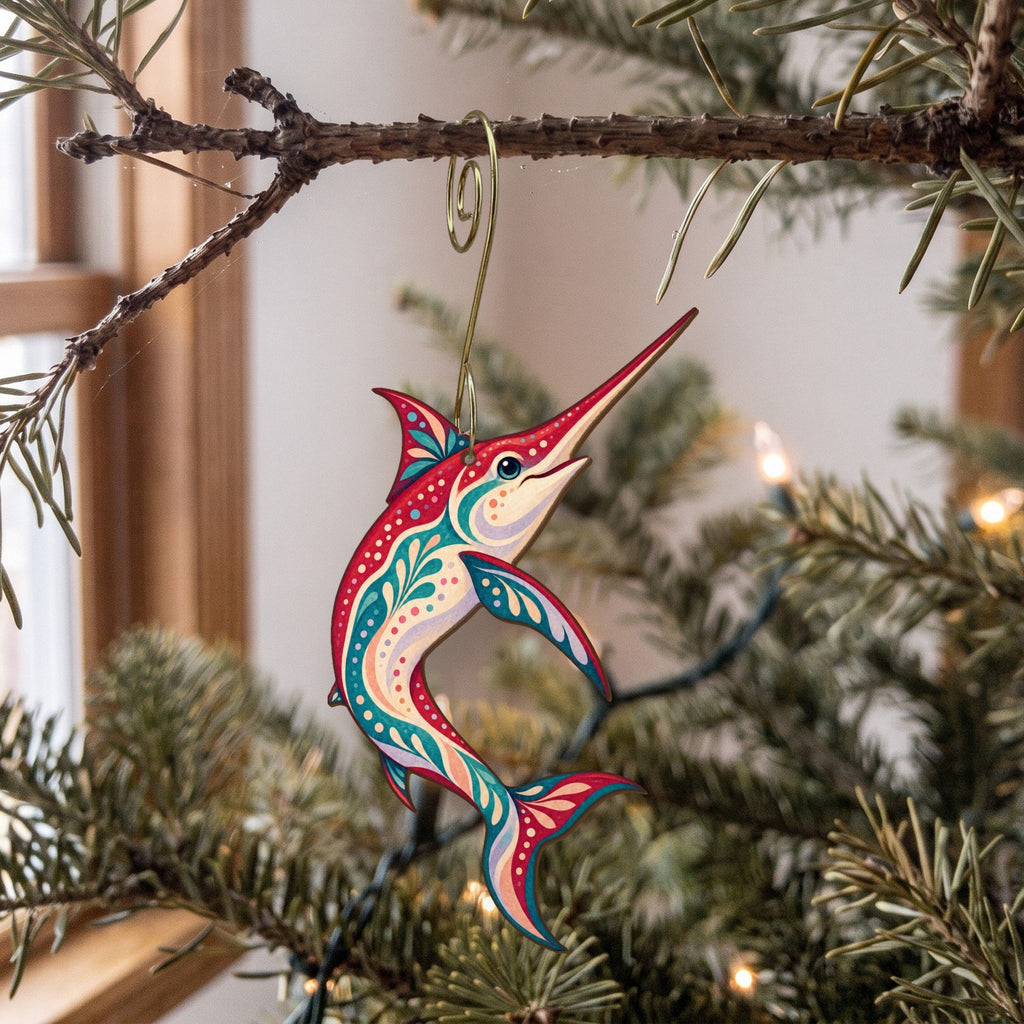 Laser-cut maple wood Swordfish folk art ornament O136 hanging on a fir branch, made in USA