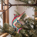 Laser-cut maple wood Swordfish folk art ornament O136 hanging on a fir branch, made in USA