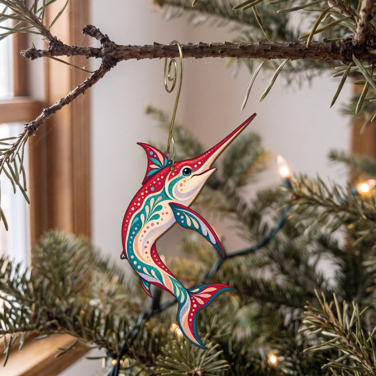 Laser-cut maple wood Swordfish folk art ornament O136 hanging on a fir branch, made in USA