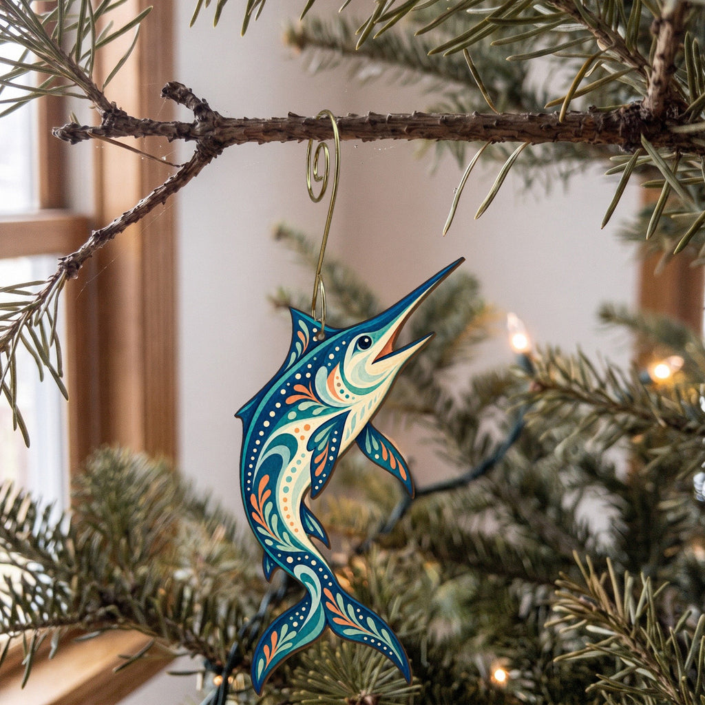 Laser-cut maple wood Blue Marlin folk art ornament O137 hanging on a fir branch, made in USA