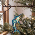 Laser-cut maple wood Blue Marlin folk art ornament O137 hanging on a fir branch, made in USA