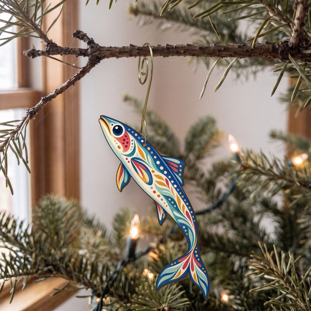 Laser-cut maple wood Anchovy folk art ornament O141 hanging on a fir branch, made in USA