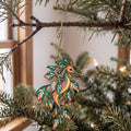 Laser-cut maple wood Weedy Seadragon folk art ornament O151 hanging on a fir branch, made in USA