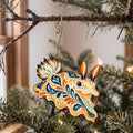 Laser-cut maple wood Sea Bunny Nudibranch folk art ornament O162 hanging on a fir branch, made in USA