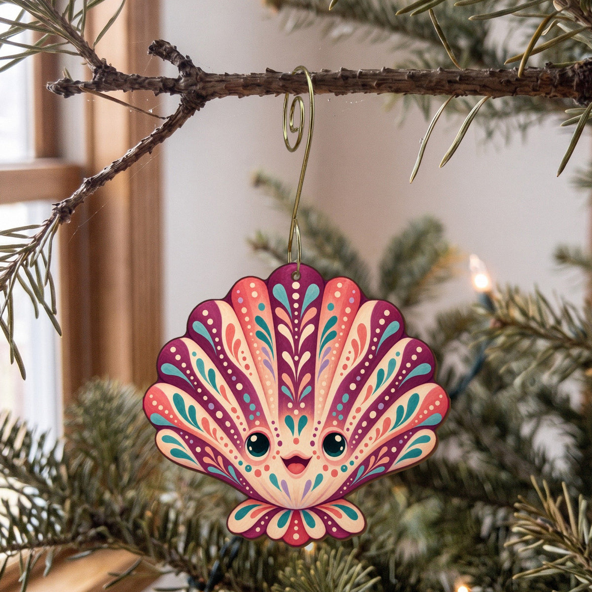 Laser-cut maple wood Scallop folk art ornament O172 hanging on a fir branch, made in USA