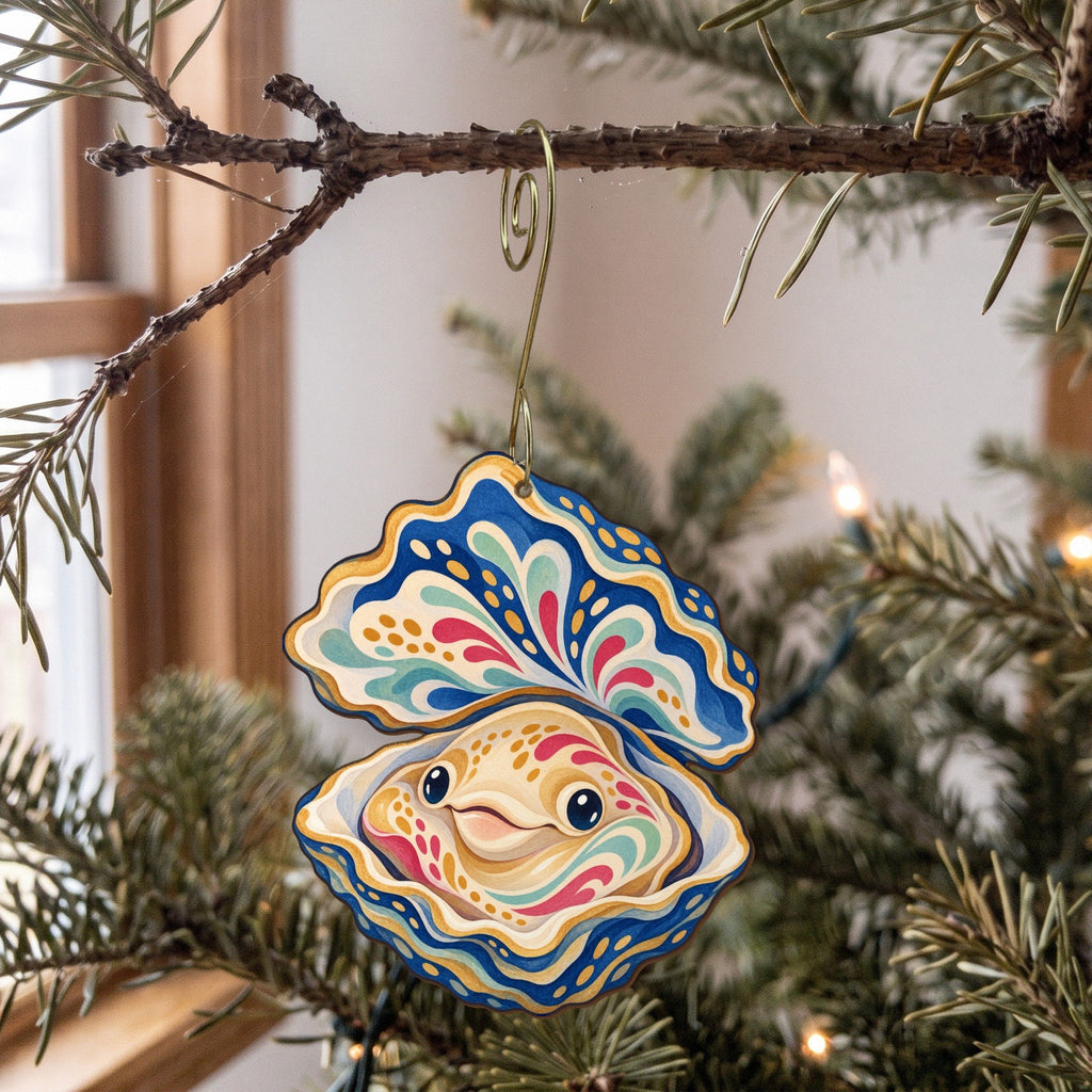 Laser-cut maple wood Oyster folk art ornament O173 hanging on a fir branch, made in USA