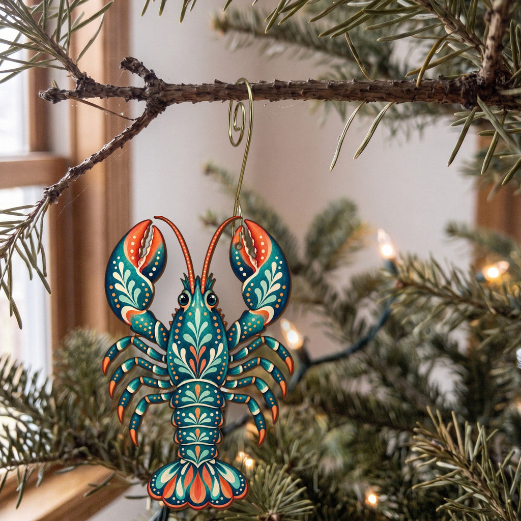 Laser-cut maple wood Lobster folk art ornament O177 hanging on a fir branch, made in USA