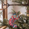 Laser-cut maple wood Mantis Shrimp folk art ornament O184 hanging on a fir branch, made in USA