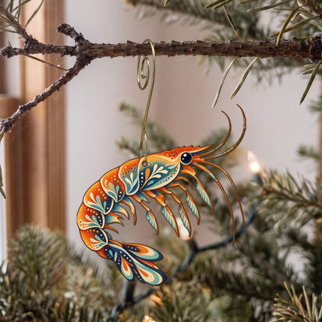Laser-cut maple wood Krill folk art ornament O186 hanging on a fir branch, made in USA