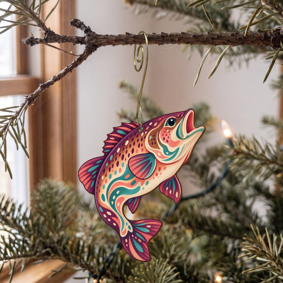 Laser-cut maple wood Smallmouth Bass folk art ornament O188 hanging on a fir branch, made in USA
