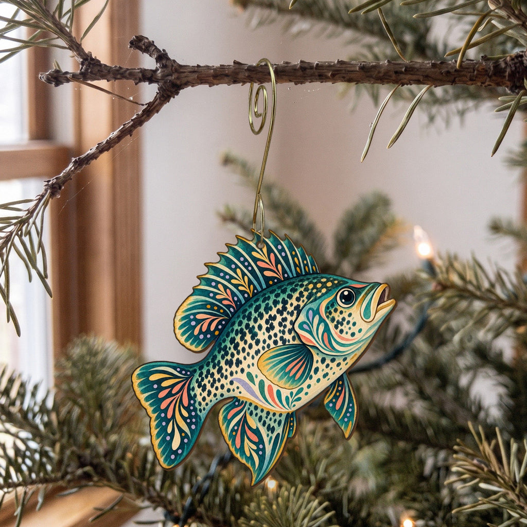 Laser-cut maple wood Black Crappie folk art ornament O191 hanging on a fir branch, made in USA