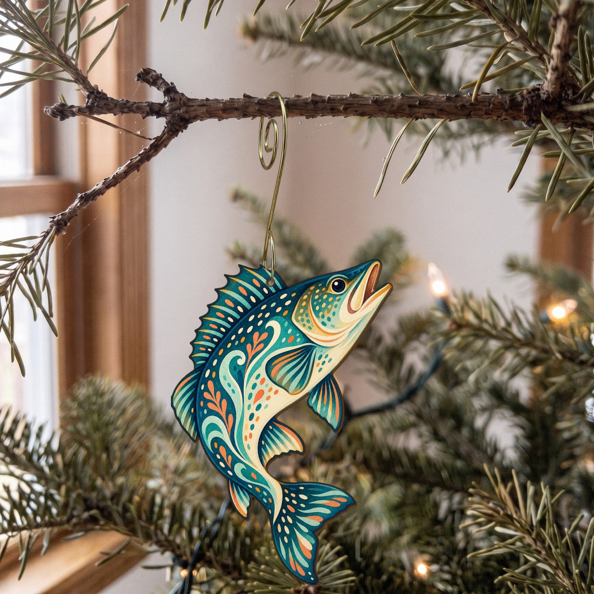 Laser-cut maple wood Walleye folk art ornament O193 hanging on a fir branch, made in USA