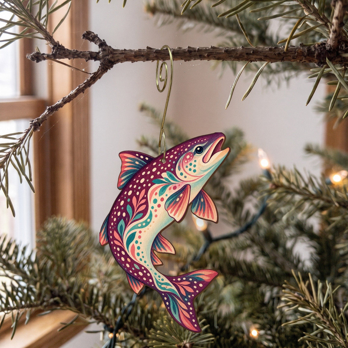 Laser-cut maple wood Lake Trout folk art ornament O196 hanging on a fir branch, made in USA