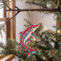 Laser-cut maple wood Lake Sturgeon folk art ornament O200 hanging on a fir branch, made in USA