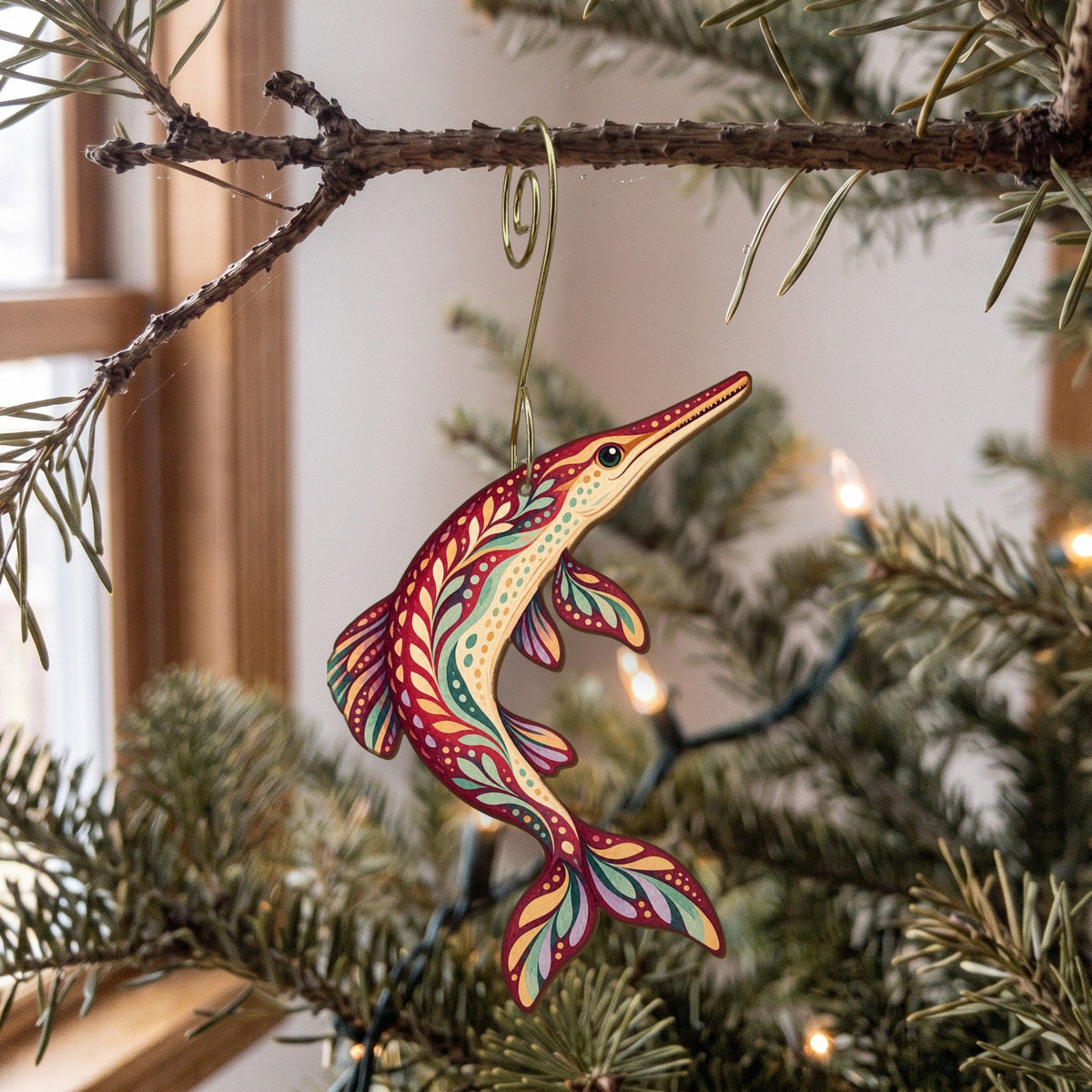 Laser-cut maple wood Longnose Gar folk art ornament O206 hanging on a fir branch, made in USA
