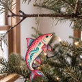 Laser-cut maple wood Lake Whitefish folk art ornament O208 hanging on a fir branch, made in USA