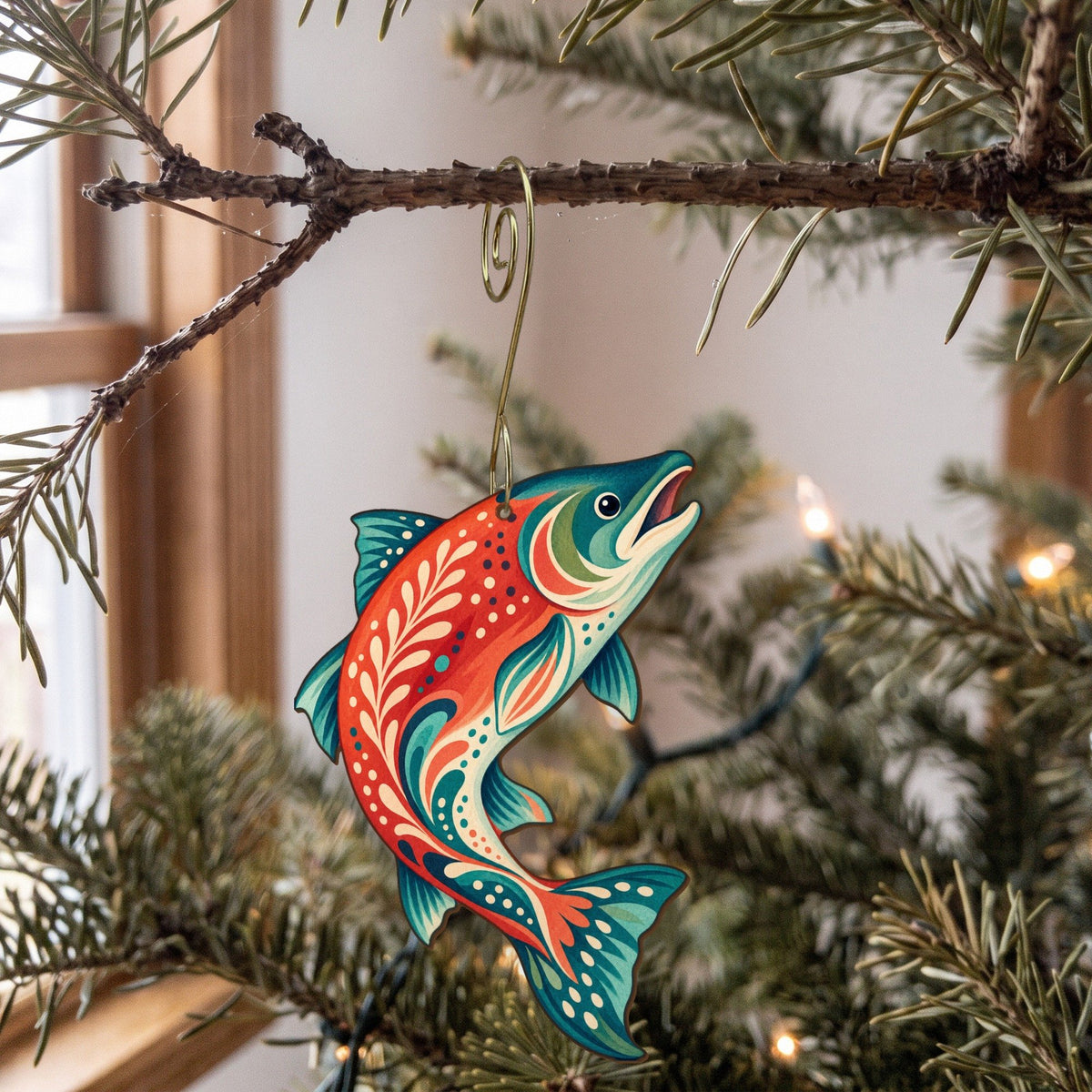 Laser-cut maple wood Sockeye Salmon folk art ornament O209 hanging on a fir branch, made in USA