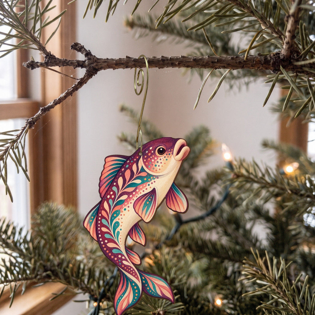Laser-cut maple wood White Sucker folk art ornament O212 hanging on a fir branch, made in USA
