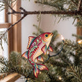 Laser-cut maple wood Roach Fish folk art ornament O214 hanging on a fir branch, made in USA