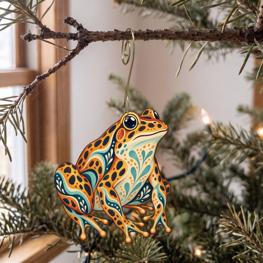 Laser-cut maple wood Leopard Frog folk art ornament O218 hanging on a fir branch, made in USA