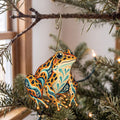 Laser-cut maple wood Leopard Frog folk art ornament O218 hanging on a fir branch, made in USA