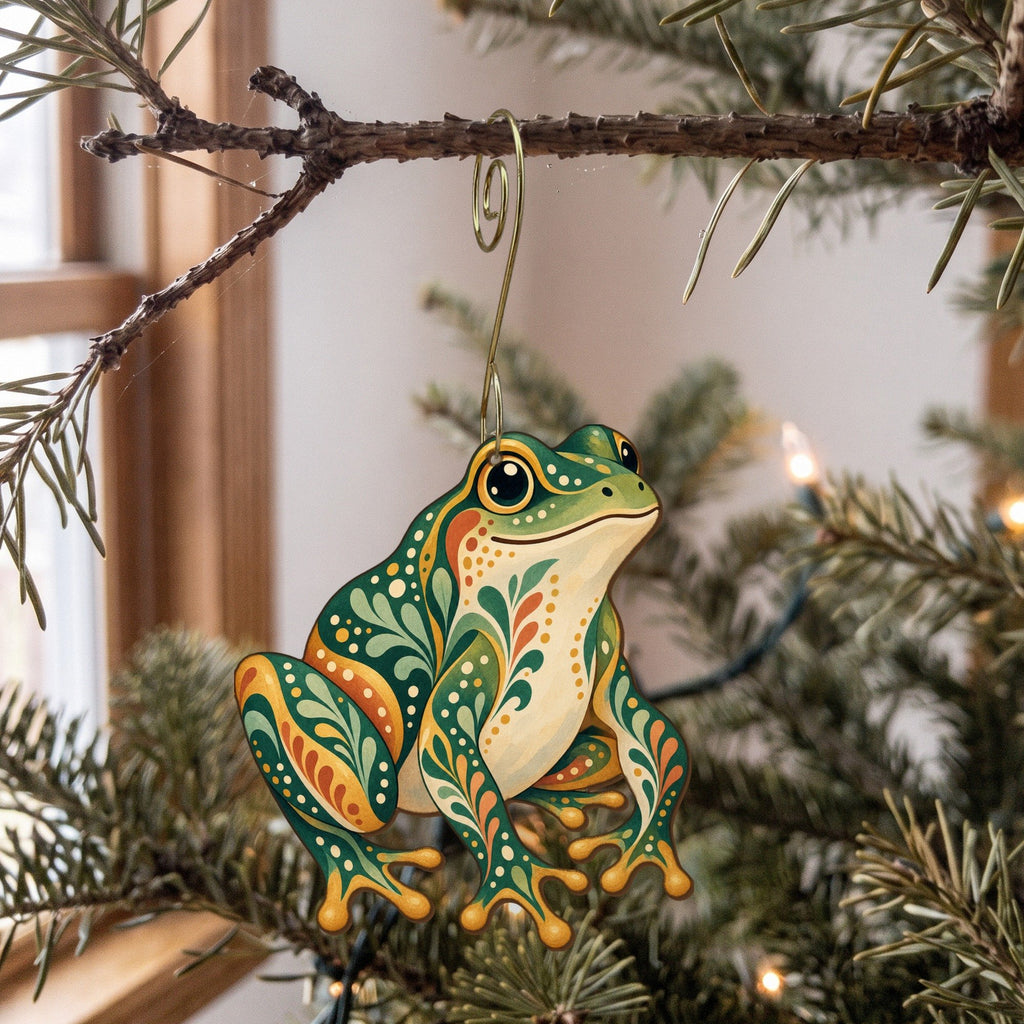 Laser-cut maple wood Green Frog folk art ornament O219 hanging on a fir branch, made in USA