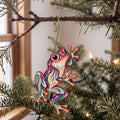Laser-cut maple wood Tree Frog folk art ornament O220 hanging on a fir branch, made in USA
