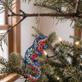 Laser-cut maple wood Fire-Bellied Newt folk art ornament O221 hanging on a fir branch, made in USA