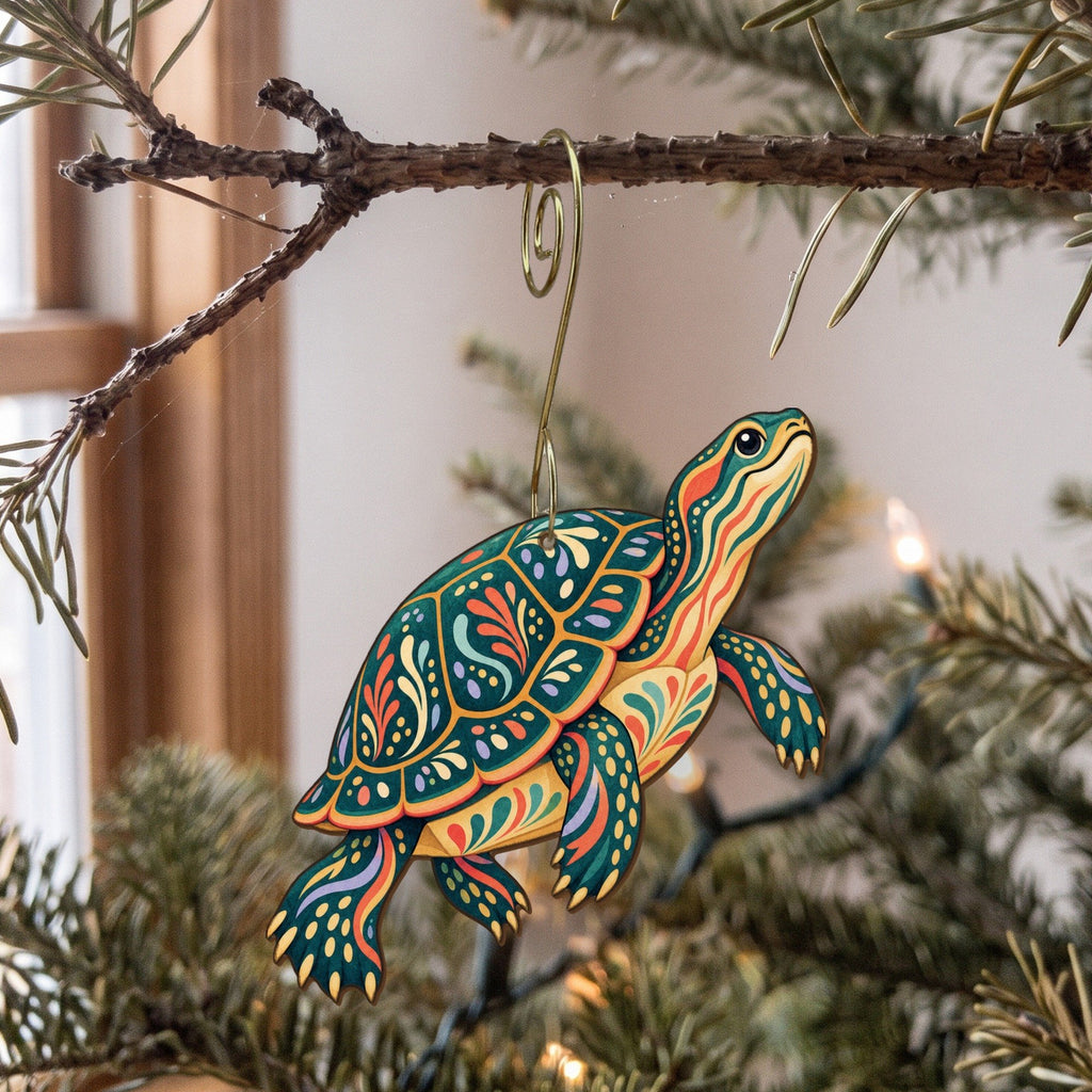 Laser-cut maple wood Painted Turtle folk art ornament O223 hanging on a fir branch, made in USA