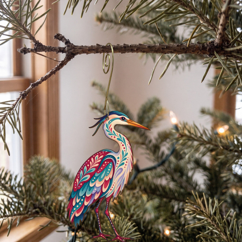 Laser-cut maple wood Great Blue Heron folk art ornament O232 hanging on a fir branch, made in USA