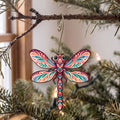Laser-cut maple wood Dragonfly folk art ornament O236 hanging on a fir branch, made in USA