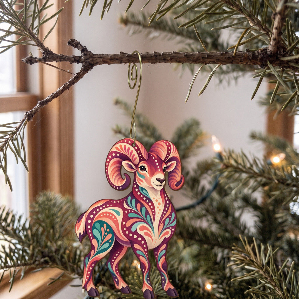 Laser-cut maple wood Bighorn Sheep folk art ornament O244 hanging on a fir branch, made in USA