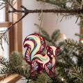 Laser-cut maple wood Striped Skunk folk art ornament O270 hanging on a fir branch, made in USA