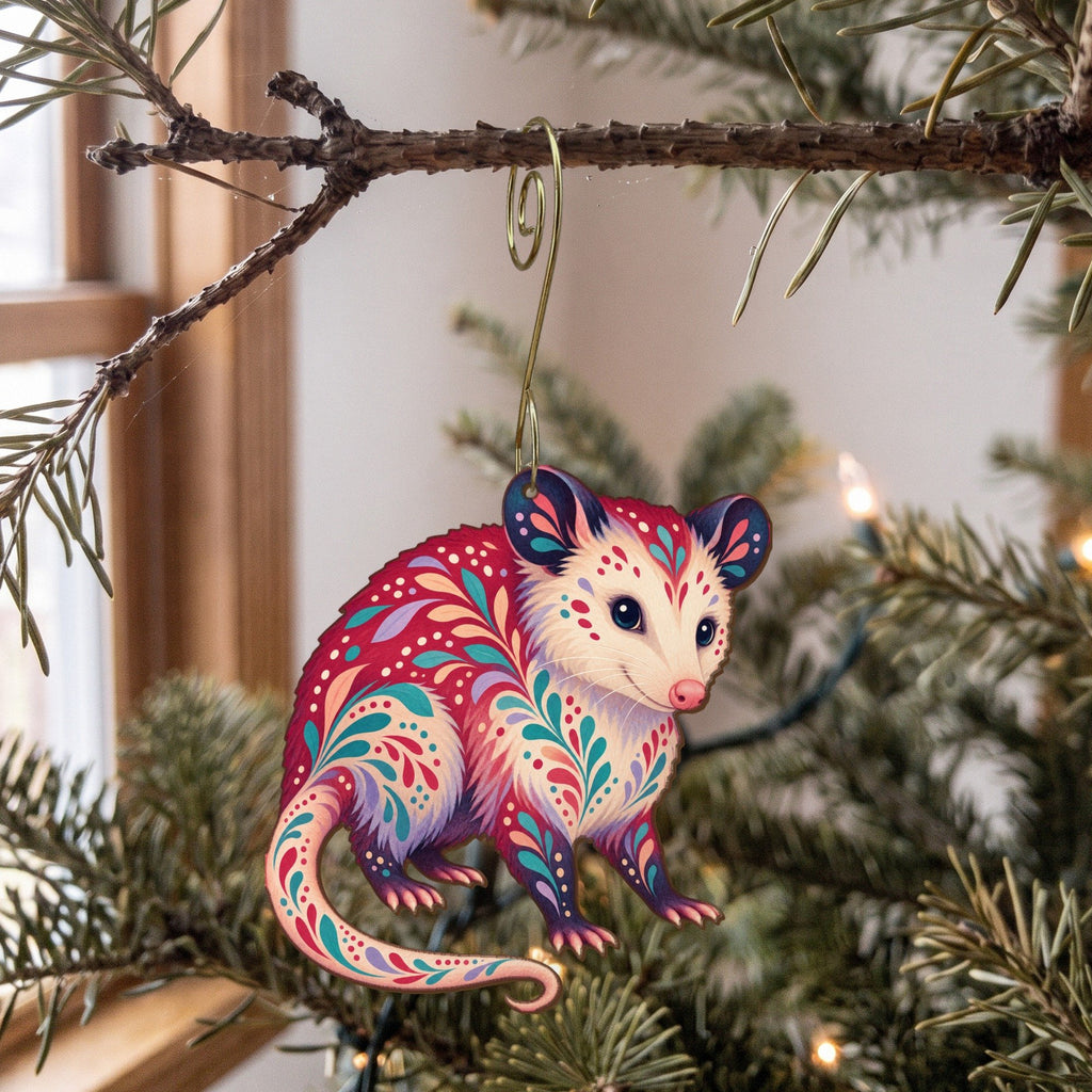 Laser-cut maple wood Virginia Opossum folk art ornament O272 hanging on a fir branch, made in USA