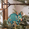 Laser-cut maple wood Nine-Banded Armadillo folk art ornament O273 hanging on a fir branch, made in USA