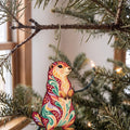 Laser-cut maple wood Prairie Dog folk art ornament O278 hanging on a fir branch, made in USA