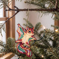 Laser-cut maple wood Northern Flying Squirrel folk art ornament O286 hanging on a fir branch, made in USA